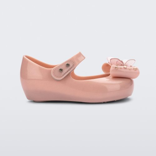 Side view of a Mini Melissa Ultragirl peeptoe ballet flat  for baby in pink with star printed butterfly bow applique. 