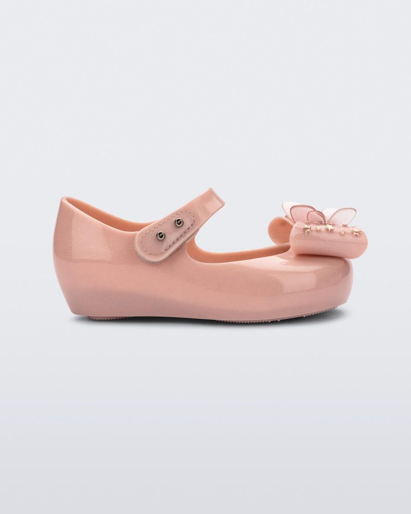 Side view of a Mini Melissa Ultragirl peeptoe ballet flat  for baby in pink with star printed butterfly bow applique.