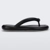 Side view of a black Melissa Free Flip Flop with puffer-like straps.