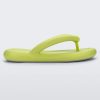 Side view of a lime green Melissa Free Flip Flop with puffer-like straps.