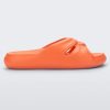 Side view of an orange Melissa Free Slide sandal in orange with a twist front detail.