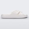 Side view of a white Melissa Free Slide with a twist front detail.