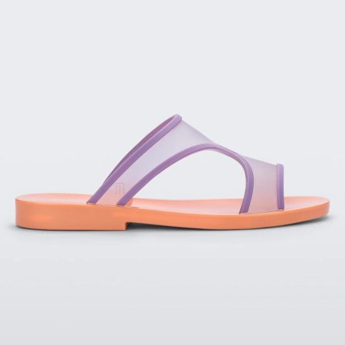 Side view of a orange/lilac Melissa Bikini Slide with a two transparent purple straps conjoining in the middle and an orange insole.