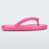 A side view of a pink Melissa Free Flip Flop with puffer-like straps.