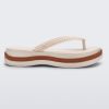 Side view of a beige/brown Melissa Leblon platform flip flop with details that mimic sisal braids on the sole and strap