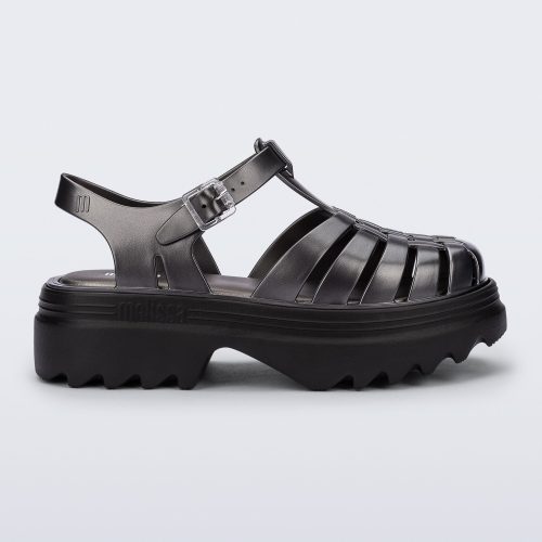 Side view of a silver Possession Platform II sandal with black sole.