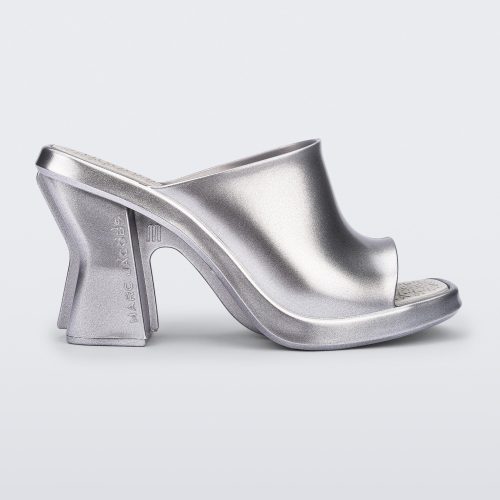 Side view of a silver Mule + Marc Jacobs heel