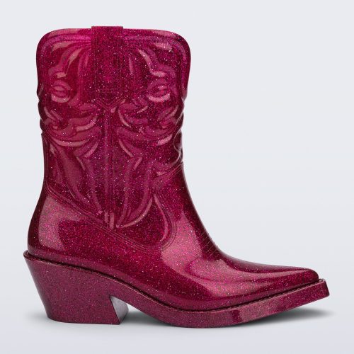 Side view of a glitter pink Texas boot with pointed toe.