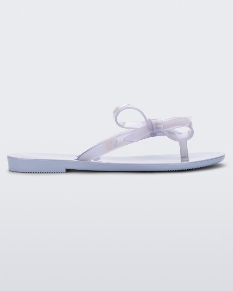 Side view of a Lilac/Blue Pearl Mini Melissa Harmonic Sweet flip flop.