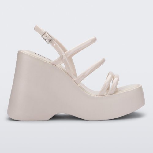 Side view of a white Jessie platform wedge sandal with side buckle ankle strap