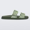 Side view of a green Lust Slide with metallic buckle straps