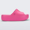 Side view of the pink Free Platform women's slide