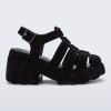 Side view of a black Megan Velvet heel sandal.