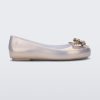 Side view of a pearly gold Mini Melissa Sweet Love Butterfly flat with a gold butterfly detail on the toe