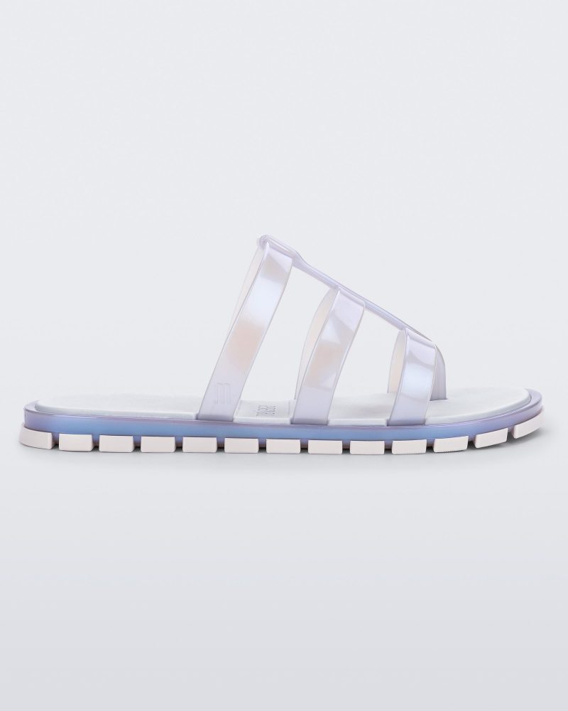 Side view of a pearly blue Path adult sandal with  blue sole