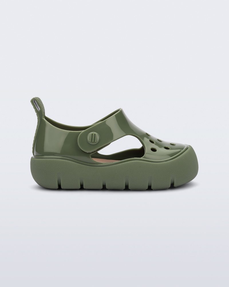 Side view of a green Bowie baby sandal.