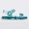 Side view of a Melissa Wide Papete sandals with transparent green sole and green velcro straps