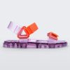 Side view of a Melissa Wide Papete sandal with transparent Purple sole and orange velcro straps.