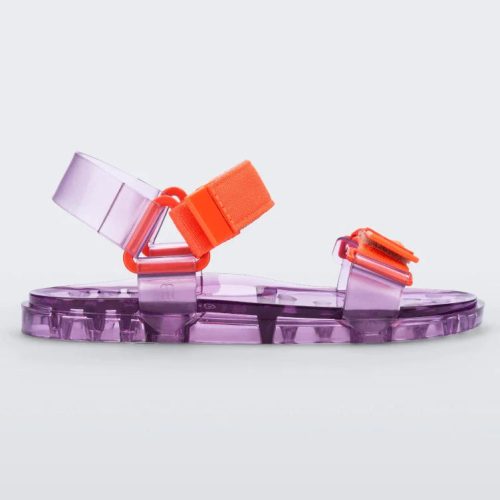 Side view of a Melissa Wide Papete sandal with transparent Purple sole and orange velcro straps.