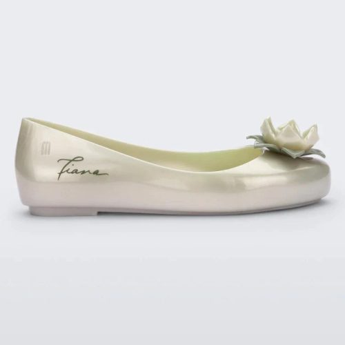 Side view of a green Mini Melissa Sweet Love Princess flat, with a pearly green base, Tiana in script on the side, a flower detail on the toe, and a drawing of Tiana of The Princess and the Frog on the sole.