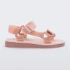 Side view of a pair of pink Melissa Papete sandals.