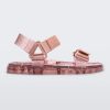 Side view of a Melissa Wide Papete sandal with transparent pink glitter sole with pink velcro straps