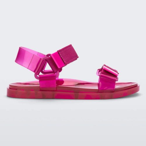 Side view of a Melissa Wide Papete sandal in pink with velcro ankle and front straps.