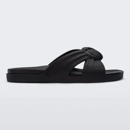 Side view of a black Melissa Plush slide with a twist front detail.