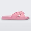 Side view of a pink Melissa Plush slide with a twist front detail.