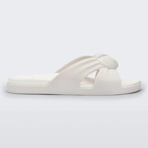 Side view of a white Melissa Plush slide with a twist front strap detail.