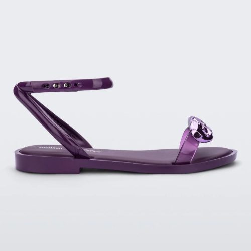 Side view of a purple Melissa Dare sandal with a purple metal chain buckle.