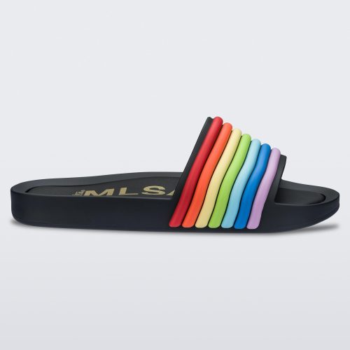 Side view of a black rainbow Melissa Rainbow Beach slide with a black base and a rainbow design on the front strap.