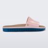 Side view of a pink Melissa Beach slide with blue sole.