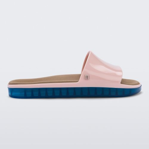 Side view of a pink Melissa Beach slide with blue sole. 