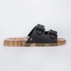 Side view of a Melissa Wide Slide sandal with gold speckled sole and two black front straps