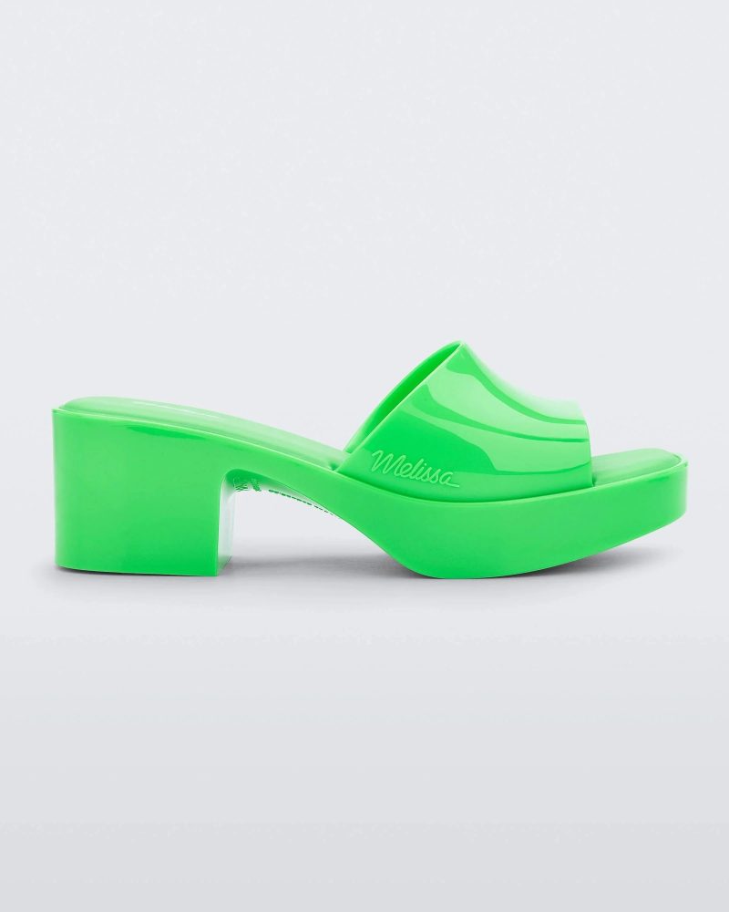 Side view of a Melissa Shape platform slide in Green.