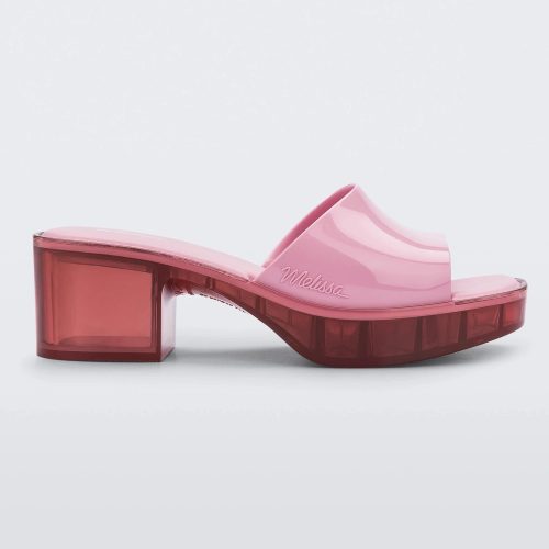 Side view of a Melissa Shape slide with transparent pink platform heel and a pink wide front strap.