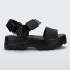 Side view of a black Melissa platform Kick Off sandal with two straps.