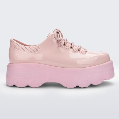 Side view of a pink platform Melissa Kick Off Sneaker with laces.