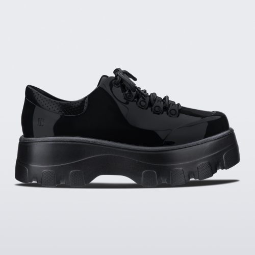 Side view of a black platform Melissa Kick Off Sneakers with laces.