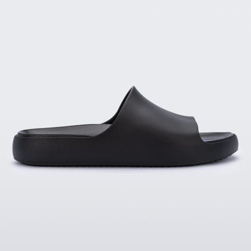 Side view of a matte black Melissa Cloud slide.