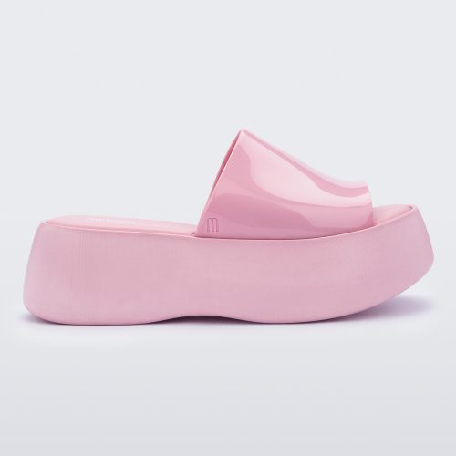 Side view of a pink Melissa Becky platform slide.