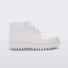 Side view of a matte white Melissa Ares combat boot with a matte white base, laces, top back and sole.