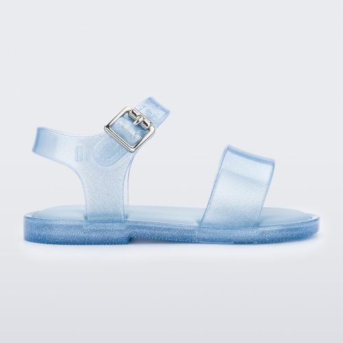 Side view of blue glitter Mini Melissa sandal with two straps and a metal buckle.