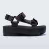 An outter side view of a black Melissa Papete Platform sandal with a black multicolor straps.