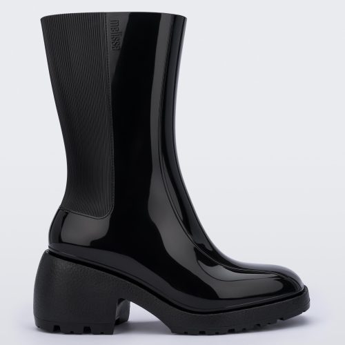 Side view of a Melissa Nancy heeled boot in black, with calf height shaft. 