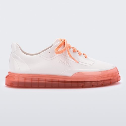 Side view of a white Melissa Classic sneaker with a white base, laces, orange sole and a melissa logo on the side.