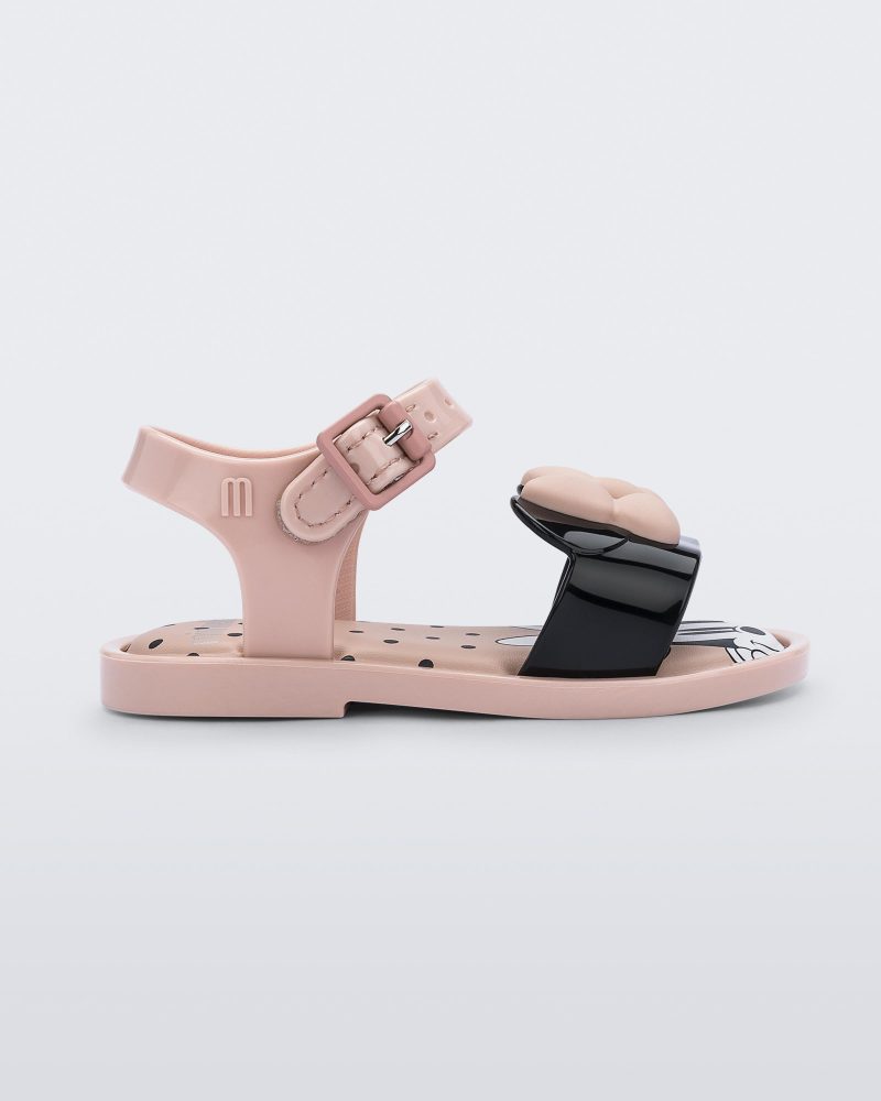 Side view of a pink and black Minnie Mouse Mini Melissa Mar Sandal with a pink bow.