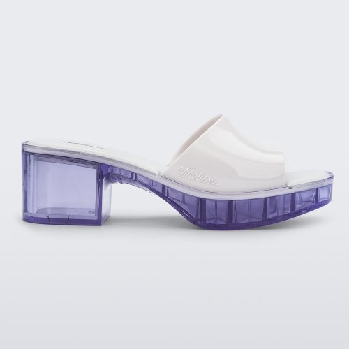 Side view of a Melissa Shape slide with clear heel and white wide strap 