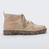 Side view of a Beige Flecked/Glitter Melissa Fluffy Boot with laces and a rubber sole.